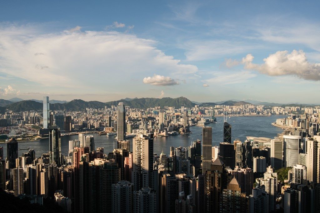 Hong Kong economy reels as tough virus restrictions implemented
