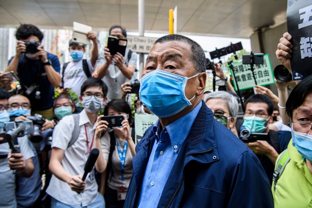 Hong Kong police raid pro-democracy newspaper after owner’s arrest