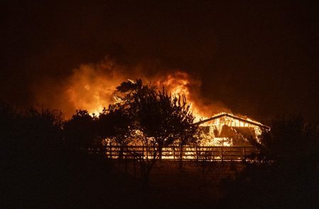 Trump dismisses climate concerns as he visits fire-ravaged western US