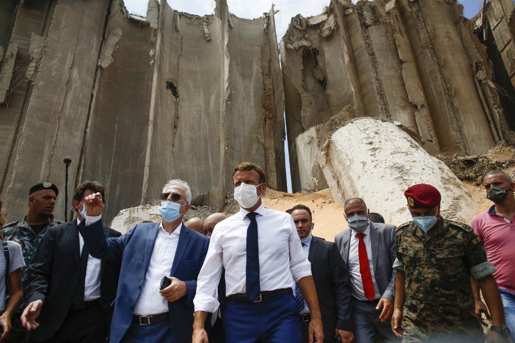 Macron visits traumatized Lebanon to offer help, urge reform