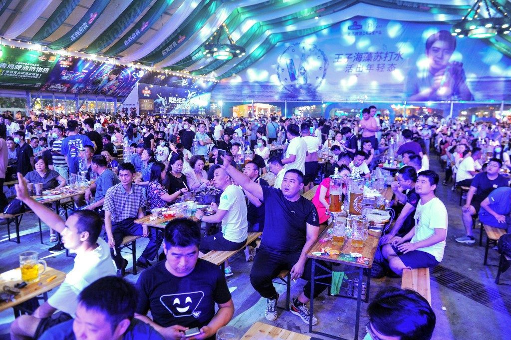 Chinese beer lovers leave face masks and worries behind as festival opens