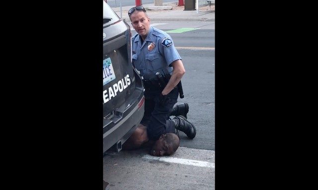 Autopsy finds cop suffocated black man as U.S. braces for more fury