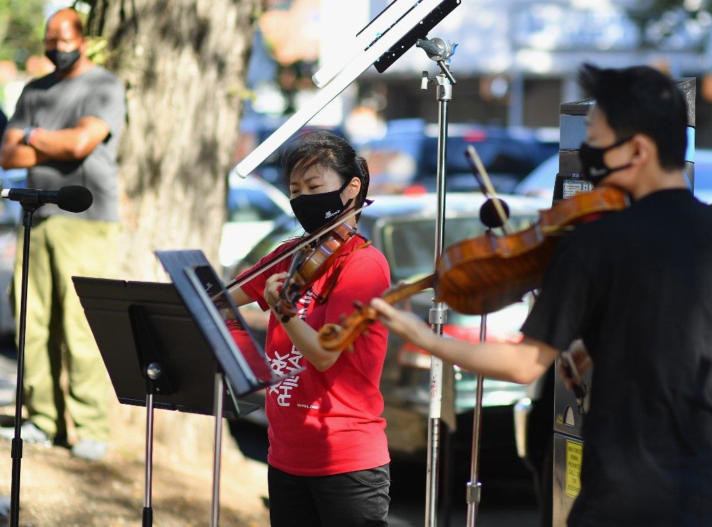 New York Philharmonic is back, pandemic-style – playing in the streets