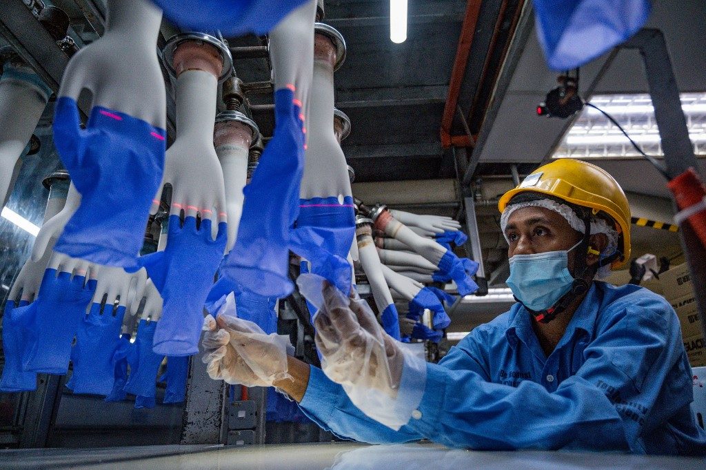 Surgical glove makers struggle to keep pace with booming demand