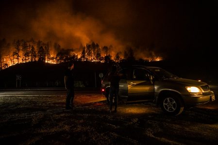 Tens of thousands flee wildfires roaring through California wine regions