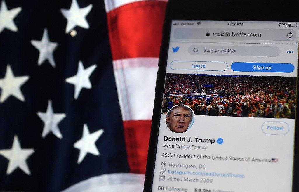 Twitter, Facebook flag Trump posts, battle spills to social media