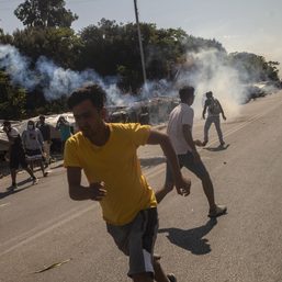 Tear gas fired during migrant protests on Greek island of Lesbos