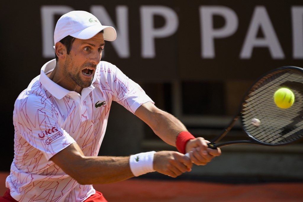 ‘Not the last racket I’ll break’: Djokovic battles into Rome semis