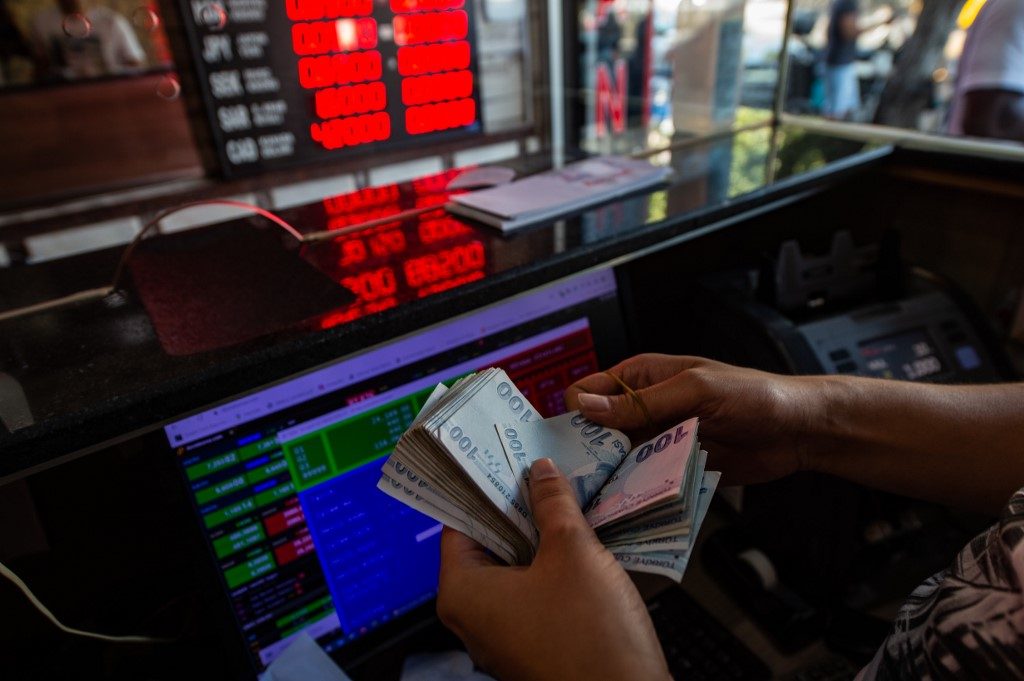 Turkish lira slides to record low of 8 against dollar