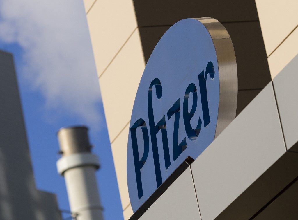 Pfizer reports lower earnings as COVID-19 hits revenues