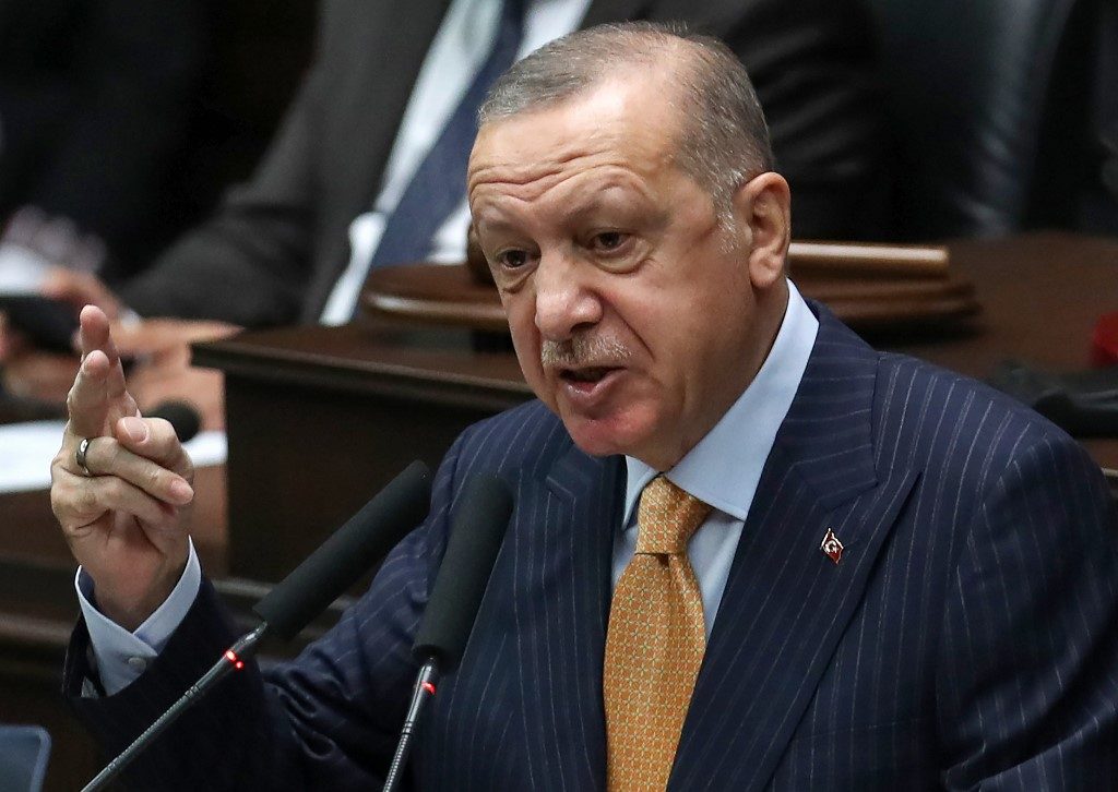 Turkey rejects EU sanctions plan as Erdogan seeks calm