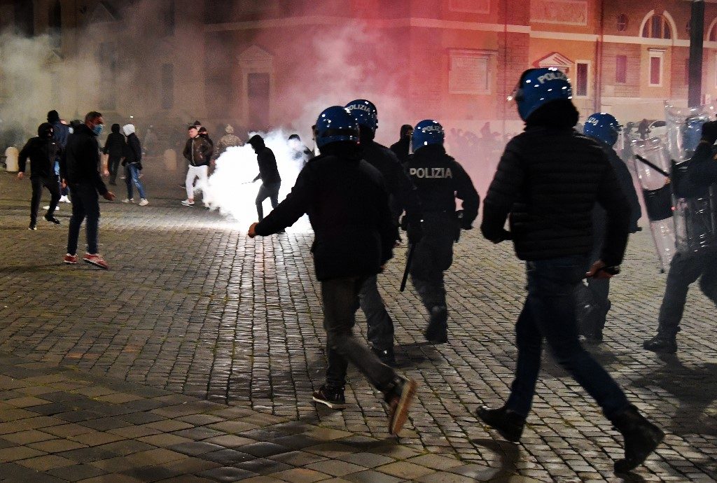 Far-right protesters clash with Rome police over virus curfew