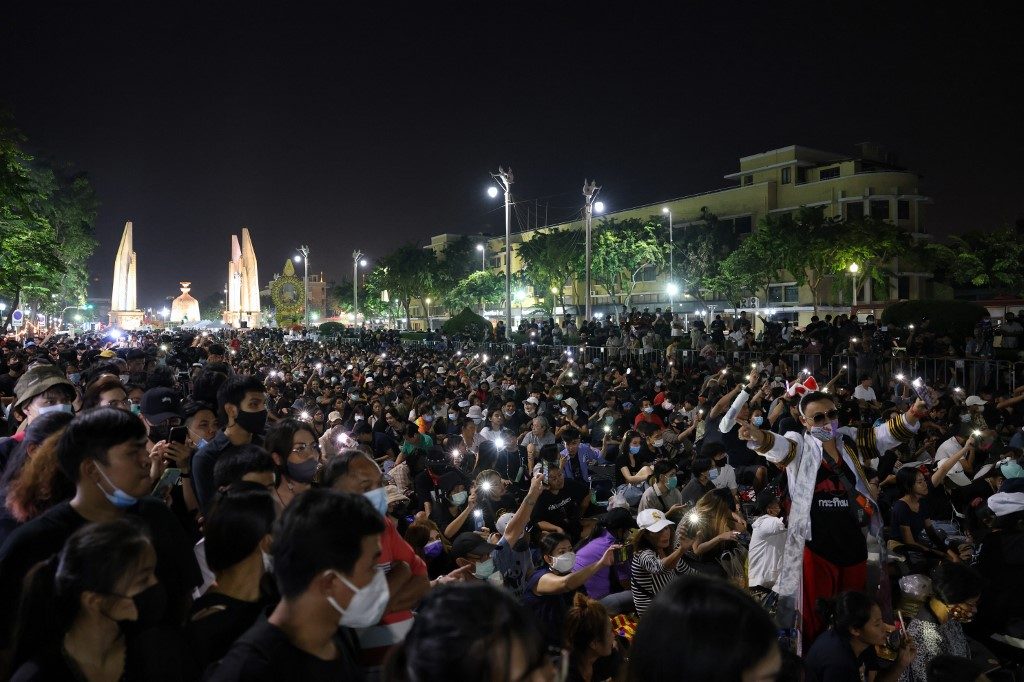 Thai pro-democracy protesters scale Bangkok monument