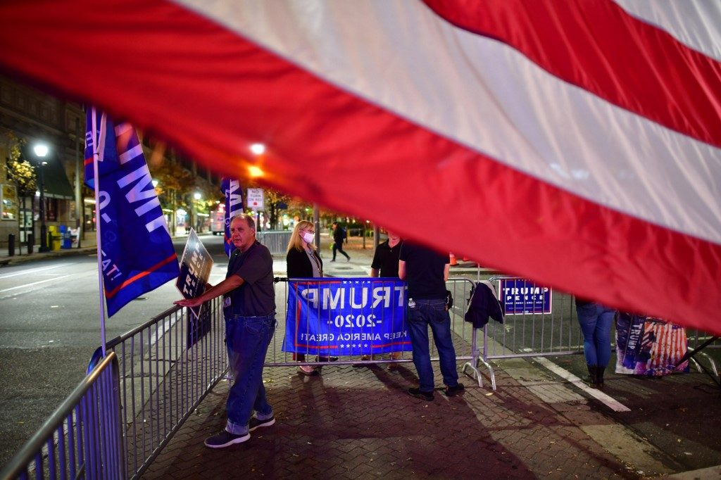 Trump supporters downcast but holding out until election results ‘certified’