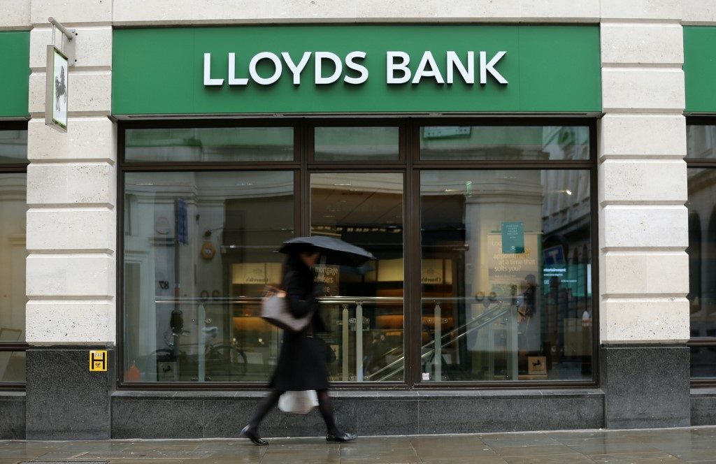 British bank Lloyds swings back to profit