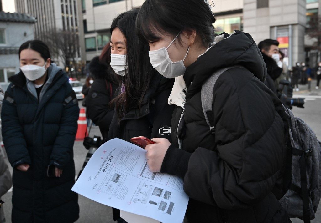 Testing time: South Korean students take high-stakes exam with virus precautions