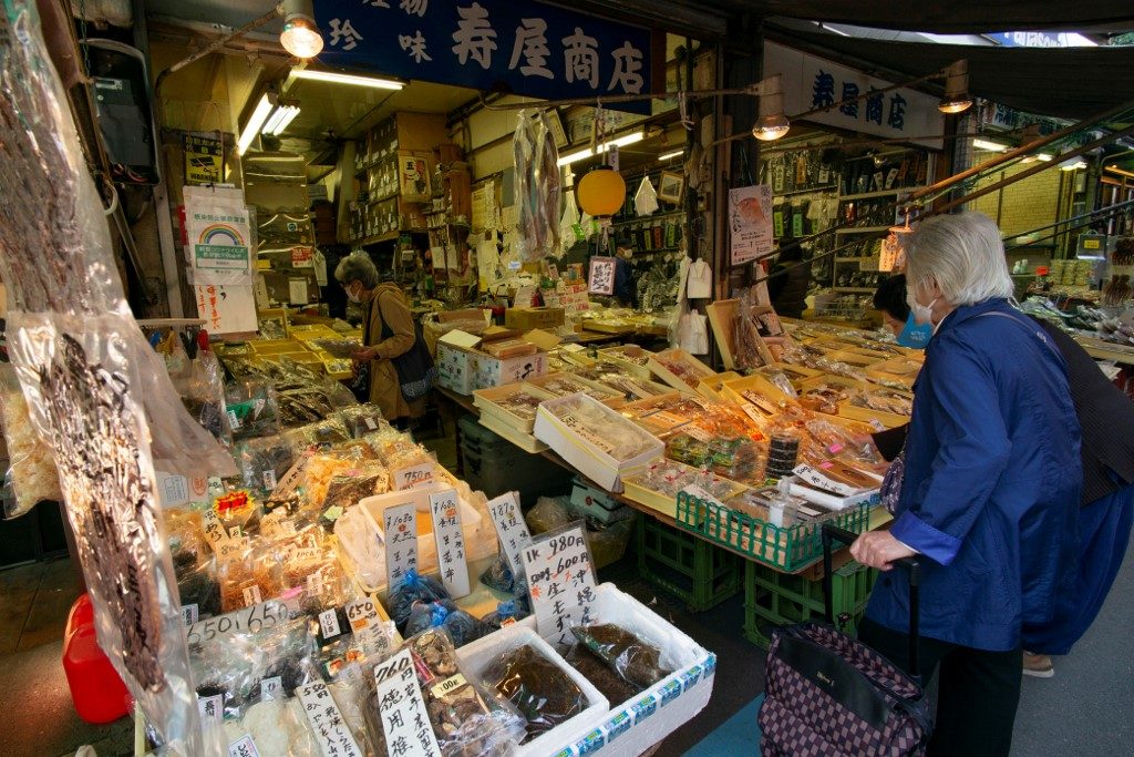 Japan household spending rises as GDP revised up