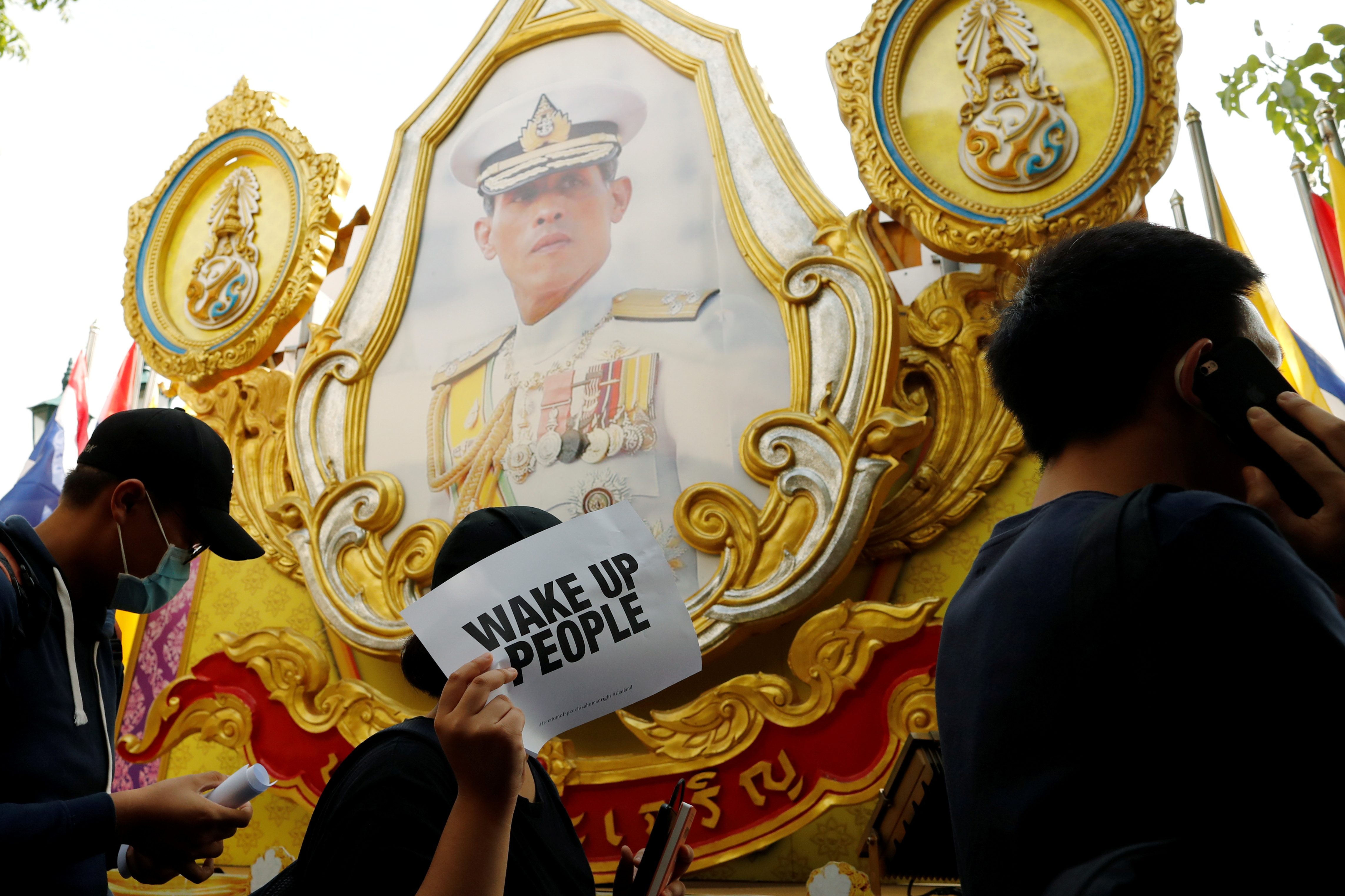 Thai protesters scuffle with police, fearing more royal insult charges