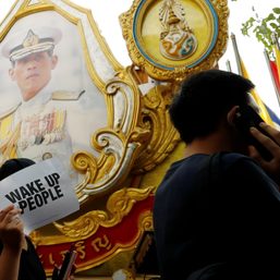 Thai protesters scuffle with police, fearing more royal insult charges