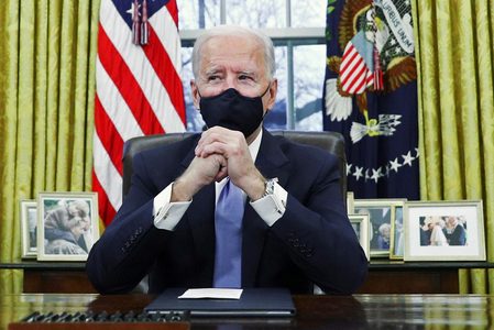 Biden rolls back Trump policies on wall, climate, health, Muslims