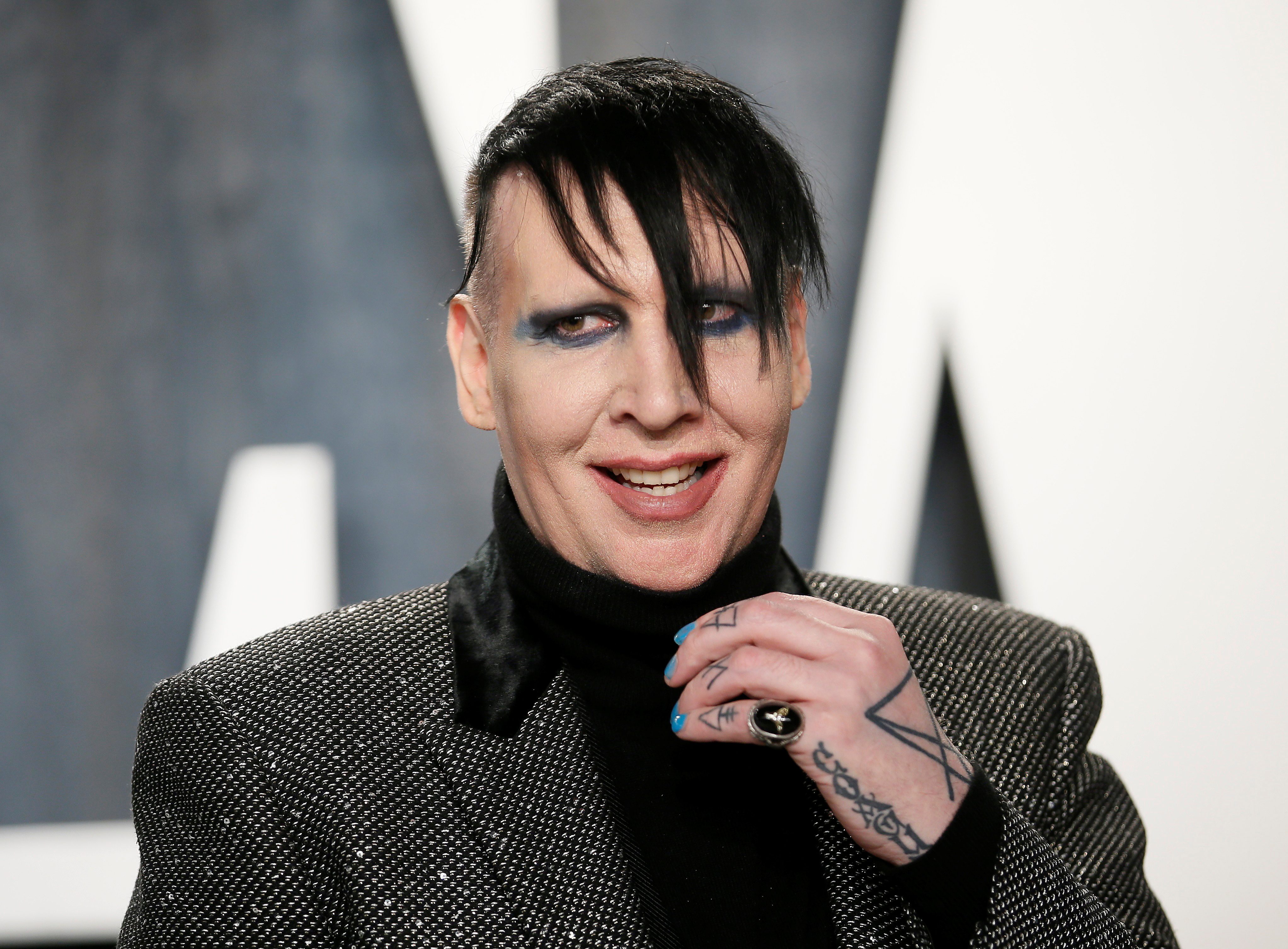 Marilyn Manson dropped by record label after abuse allegations