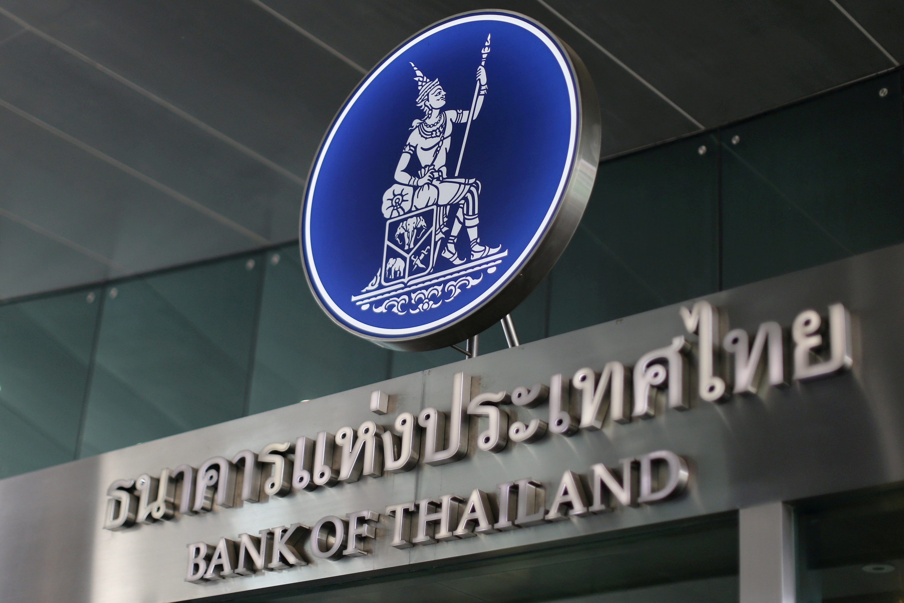 Thai central bank leaves rate at record low, warns of economic risks