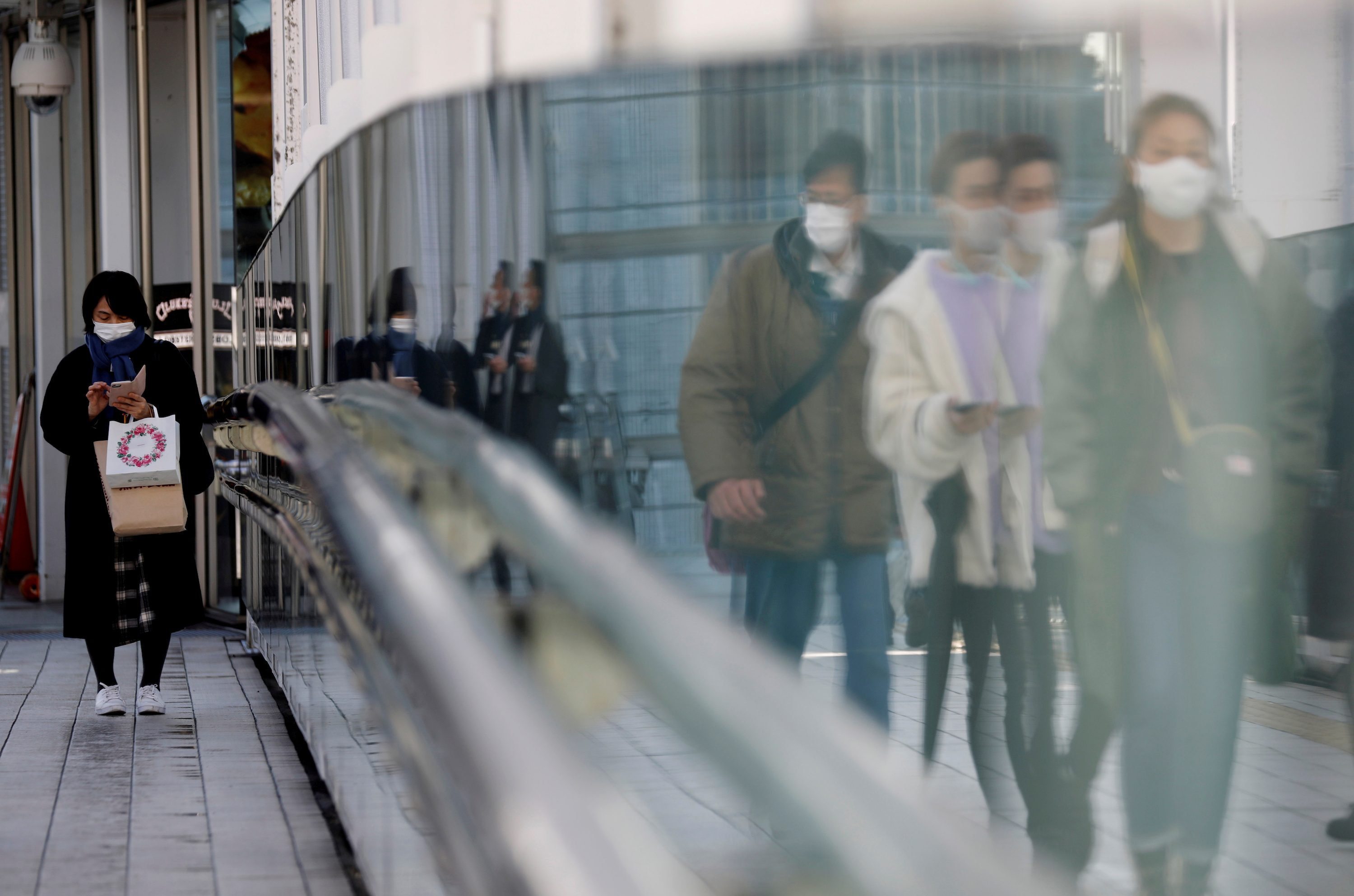 Japan’s households, firms continue to hoard cash as pandemic pain persists