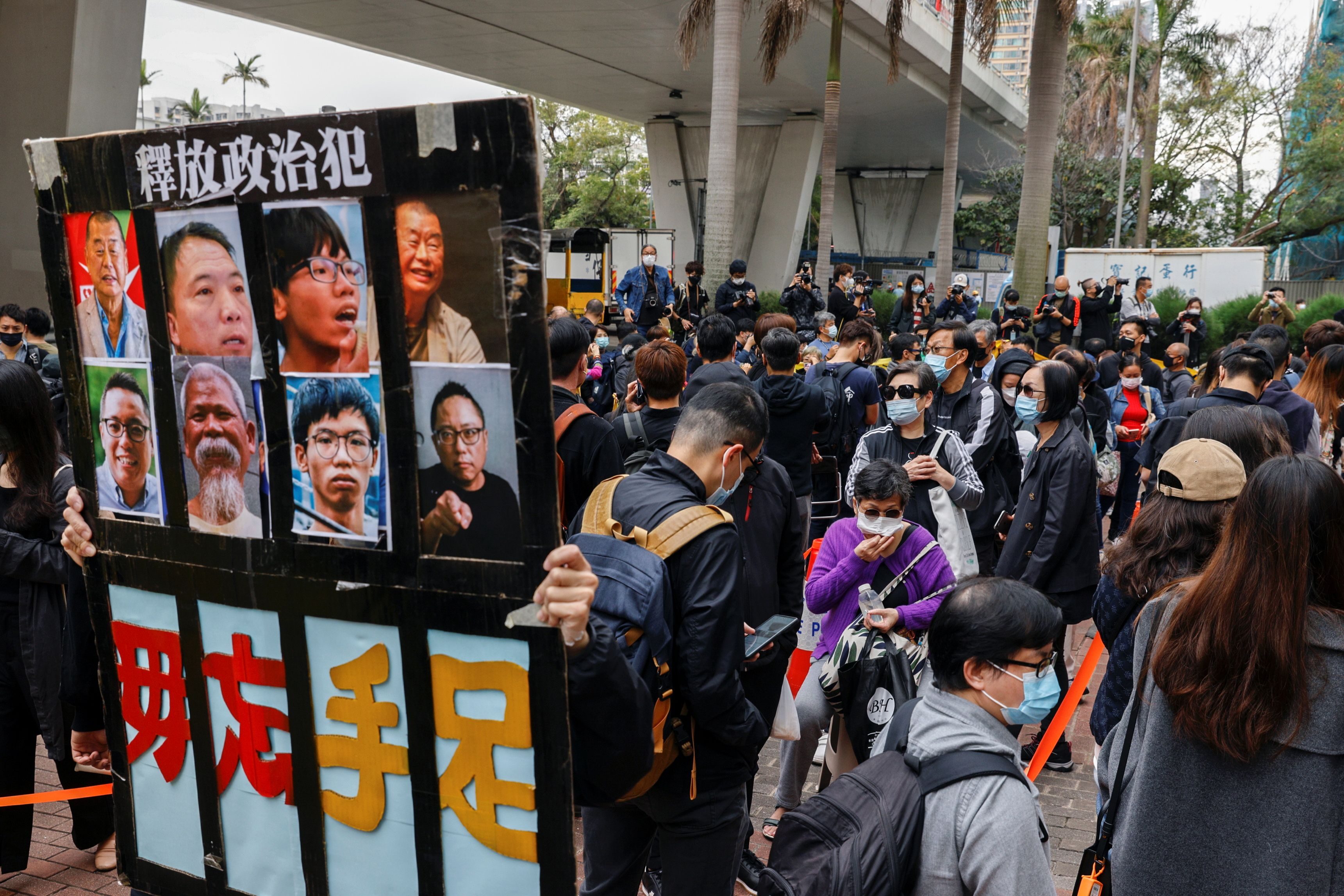 Hong Kong activists chant protest slogans as crowds gather for subversion hearing