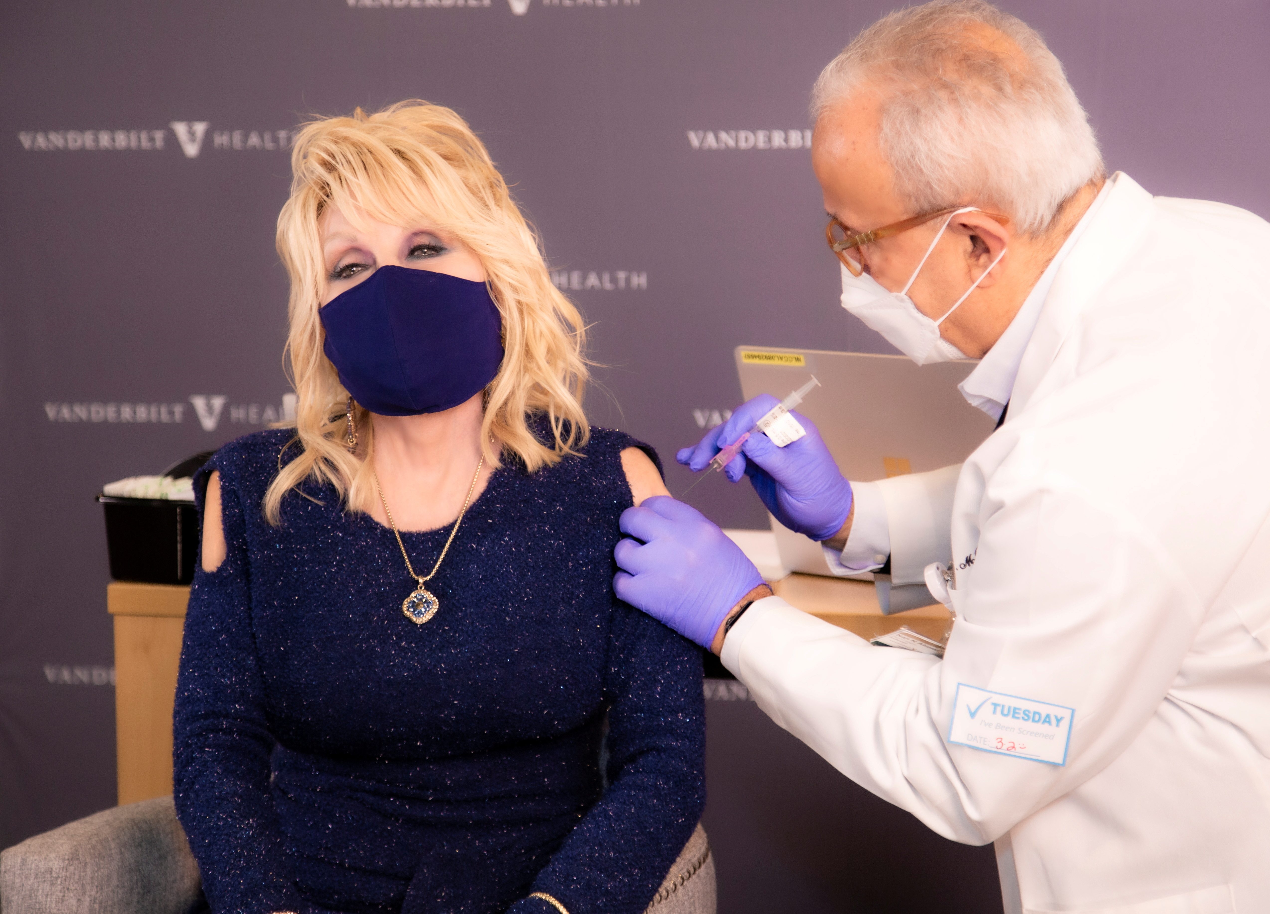 COVID-19 vaccine funder Dolly Parton gets first Moderna shot