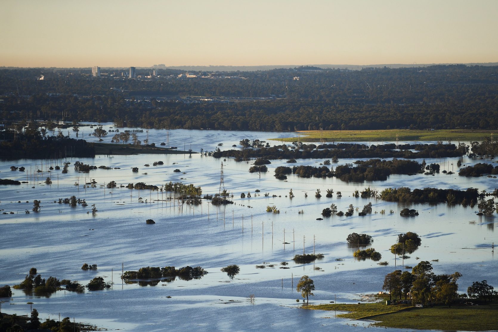 Australia floods claim first fatality; more evacuations as clean-up begins