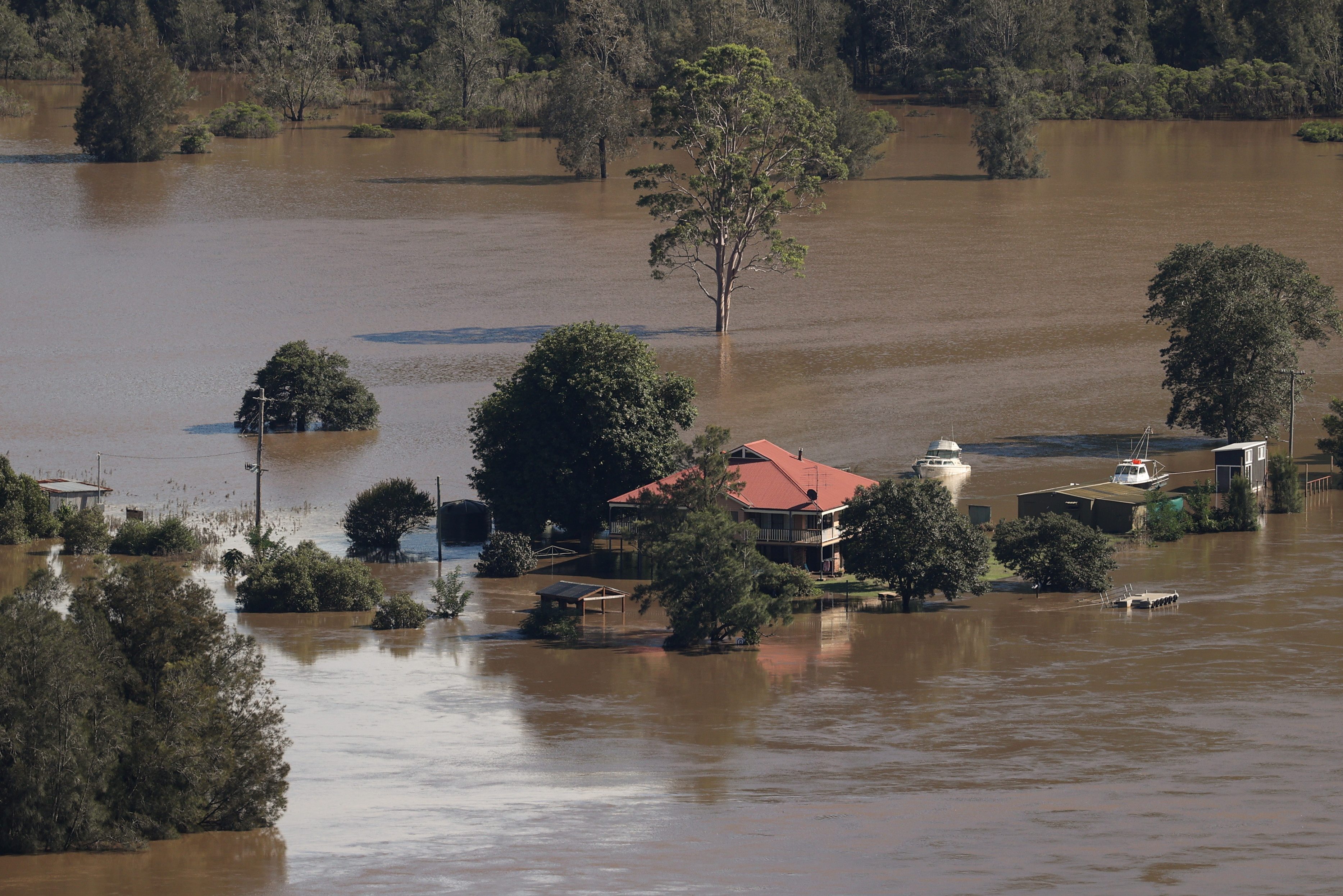 Some Australians return home as others evacuated in floods crisis