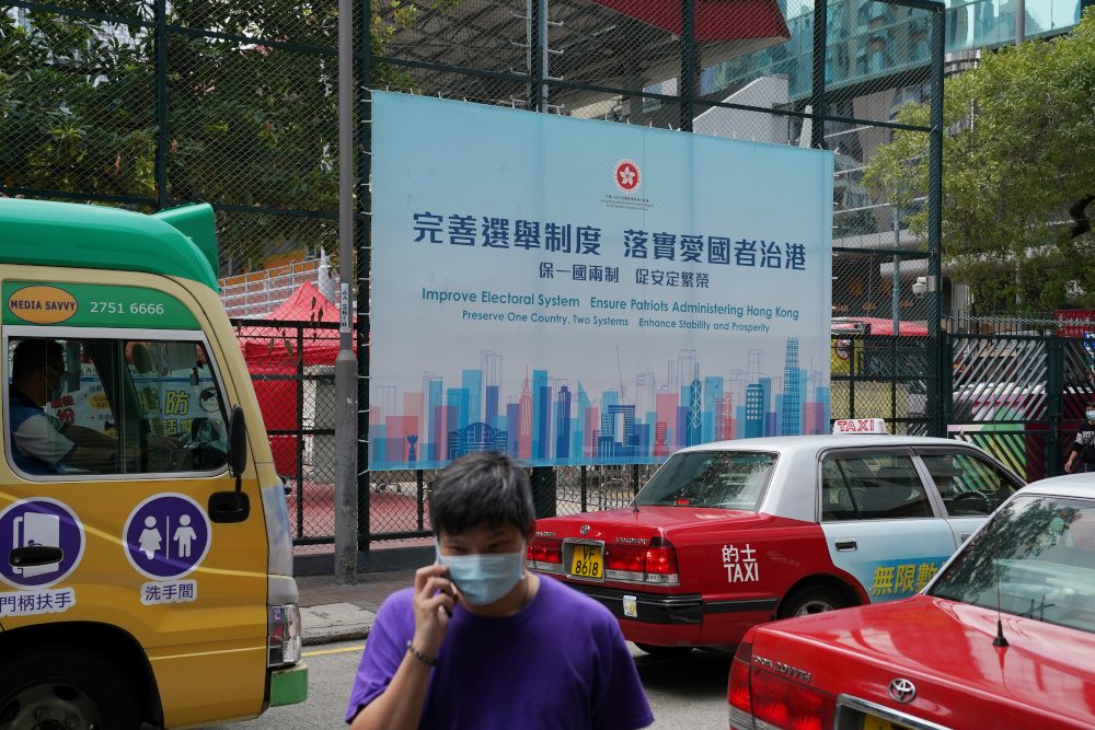 China formalizes sweeping electoral shake-up for Hong Kong, demands loyalty