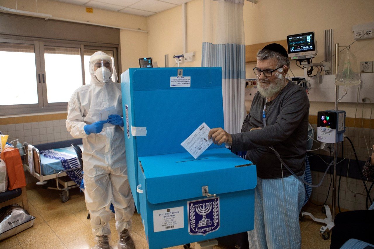 Israel votes as Netanyahu hopes vaccine rollout eclipses graft charges