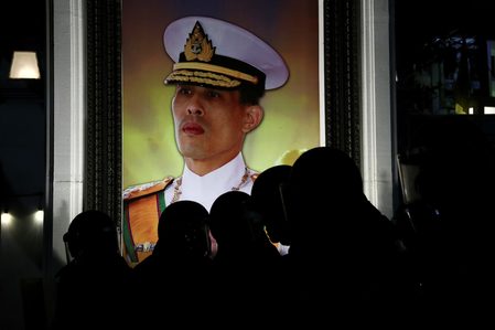 Thai activist accused of burning king’s portrait arrested