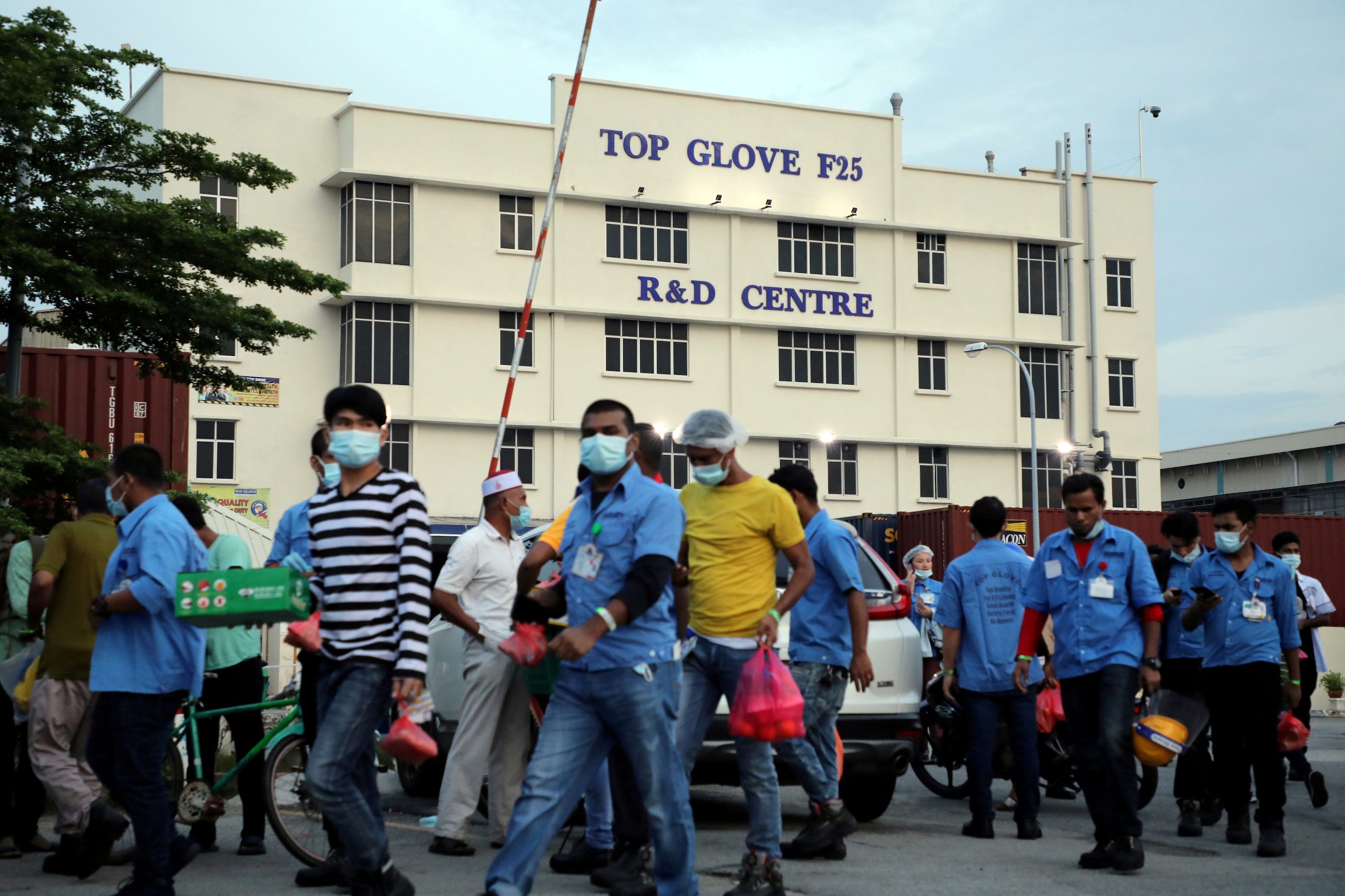 Malaysia charges Top Glove over quality of worker housing