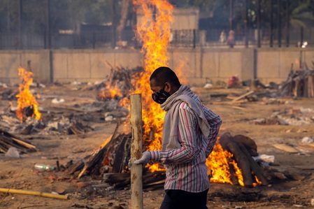 Mass cremations begin as India’s capital faces deluge of COVID-19 deaths