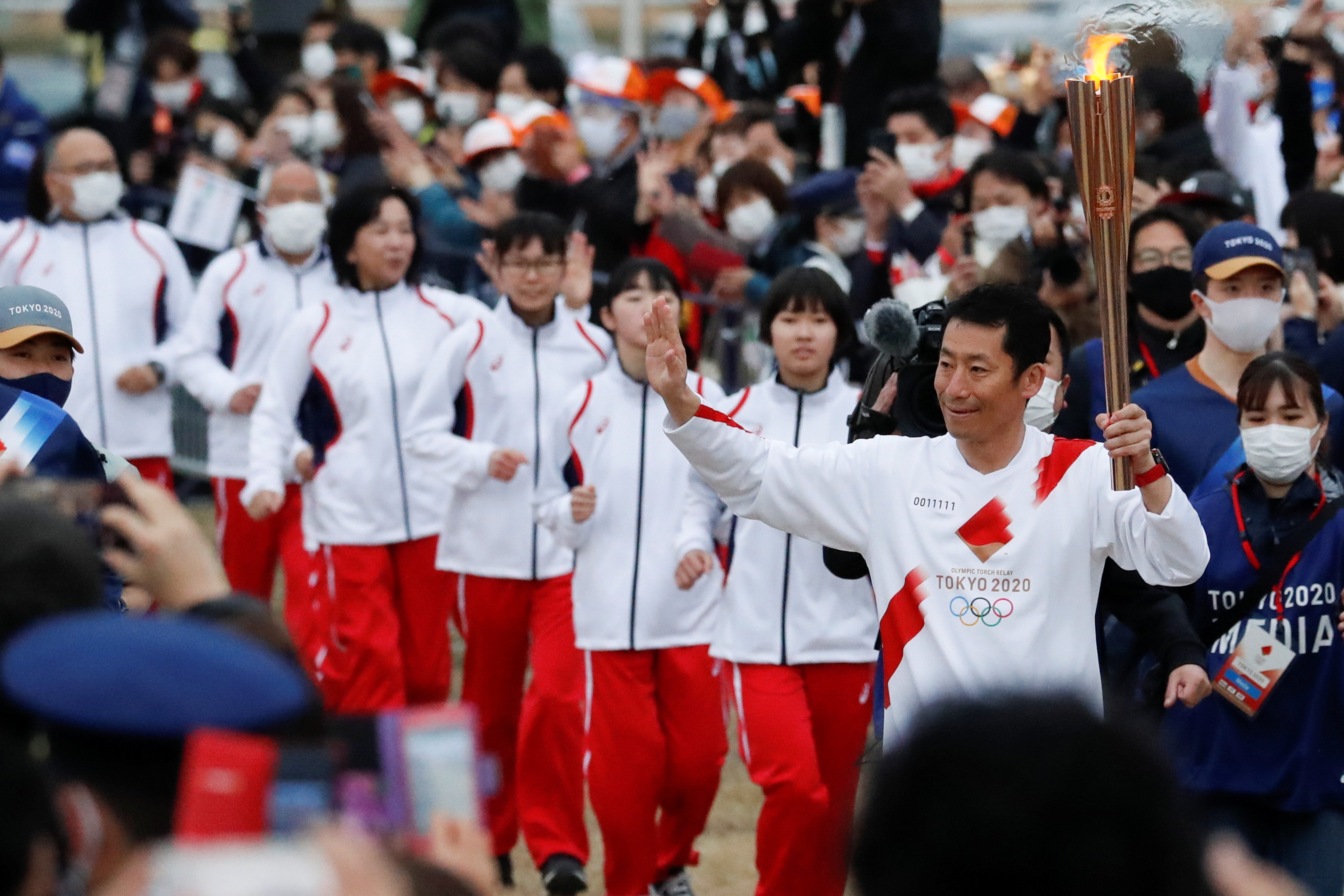 Tokyo Olympics torch staffer becomes event’s 1st COVID-19 infection