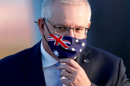 Australia sticks by plan to reopen border in mid-2022