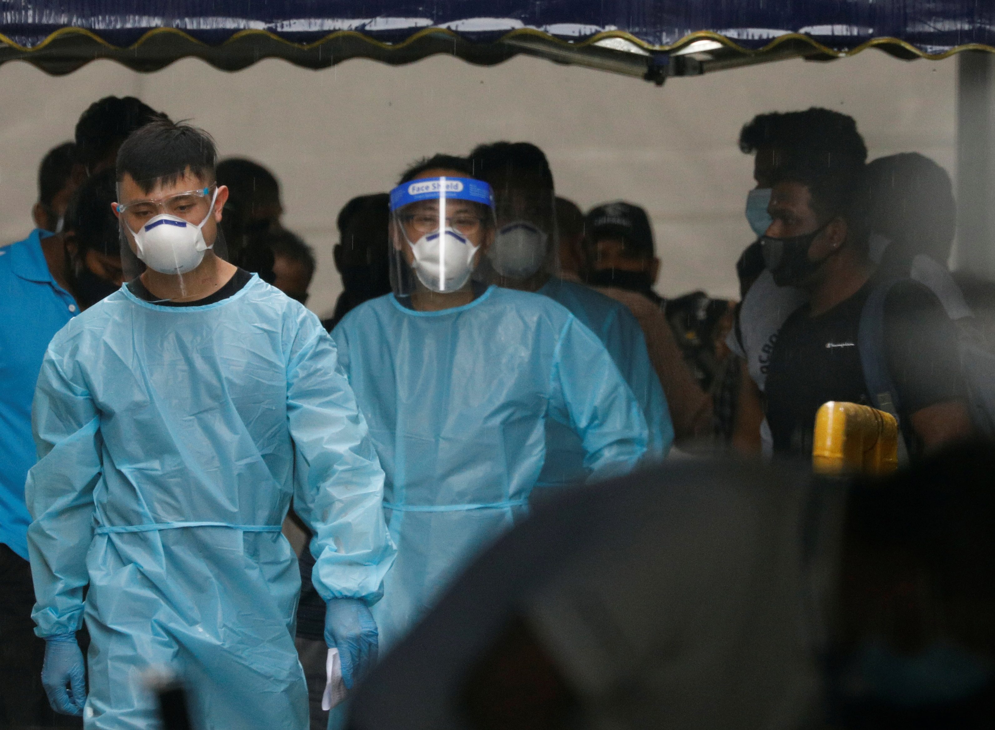 Singapore quarantines over 1,100 migrant workers, probes reinfections