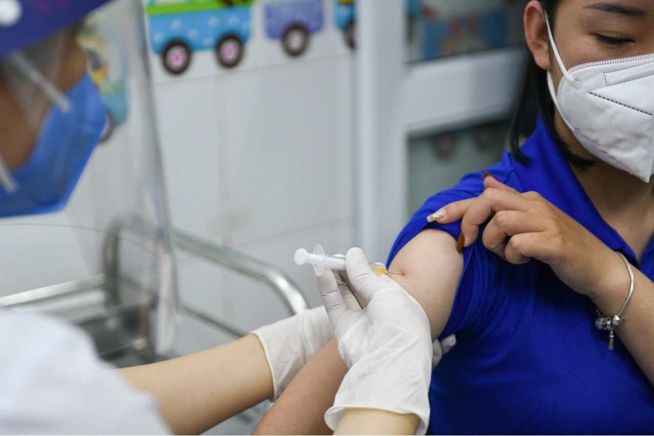 Vietnam calls for faster vaccine rollout before shots expire