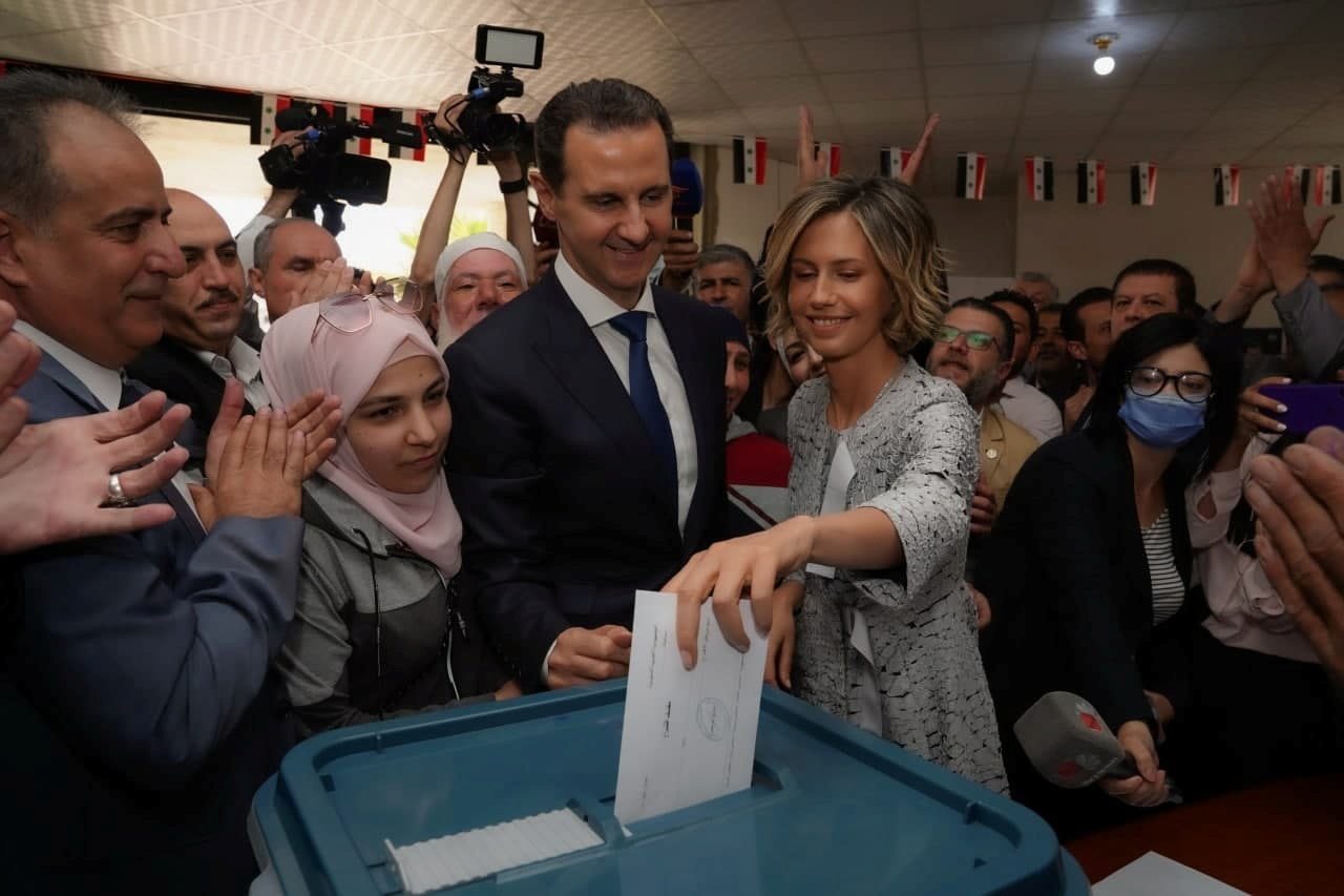 Syria’s Assad votes in former rebel town, site of chemical attack