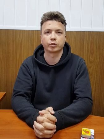 Detained Belarusian blogger appears in video, opposition cries foul