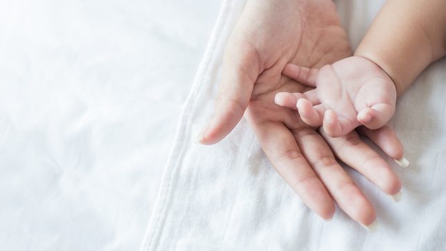 Hungarian woman with COVID-19 awakes from coma to find she’s a mother