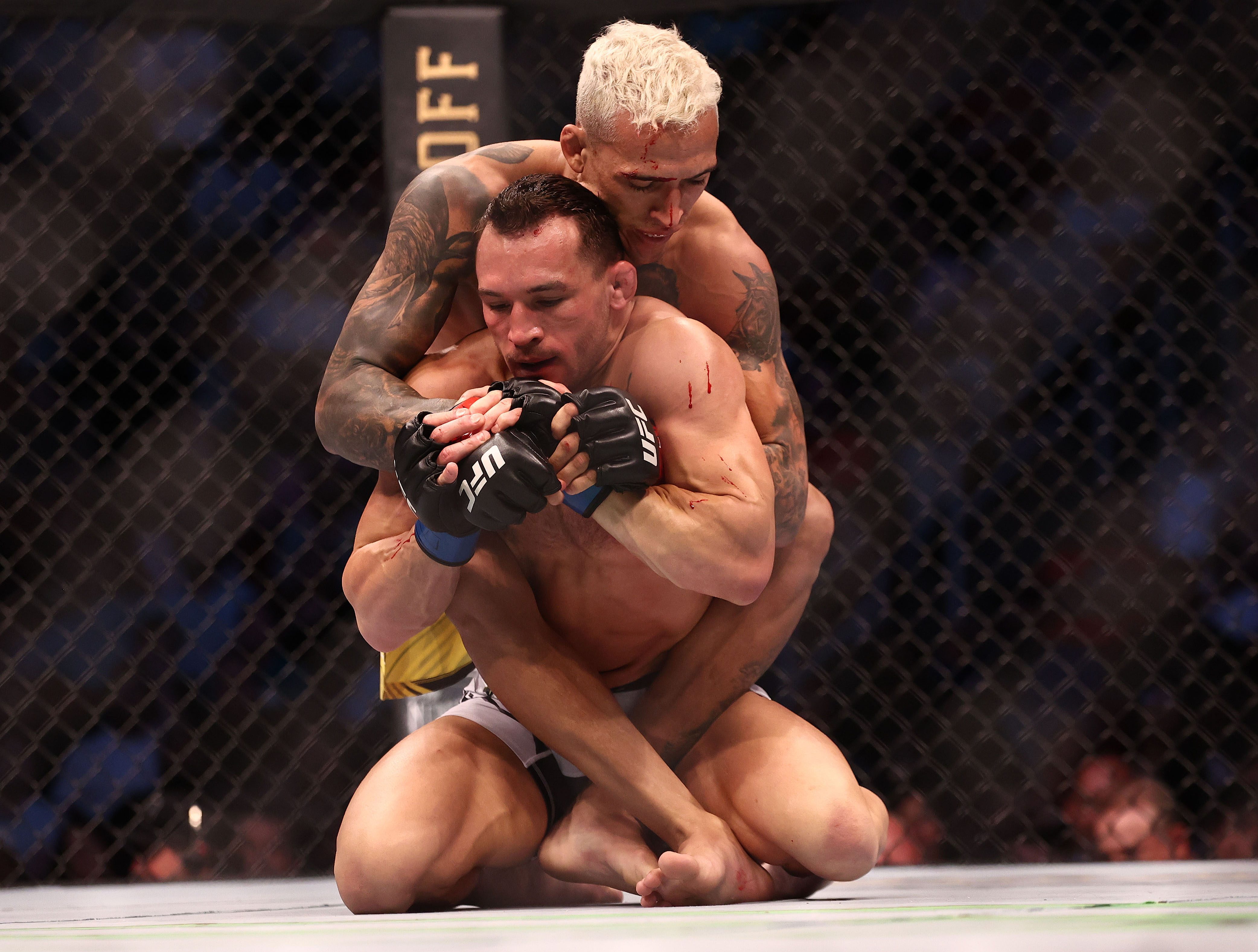 Charles Oliveira claims UFC title with TKO of Michael Chandler