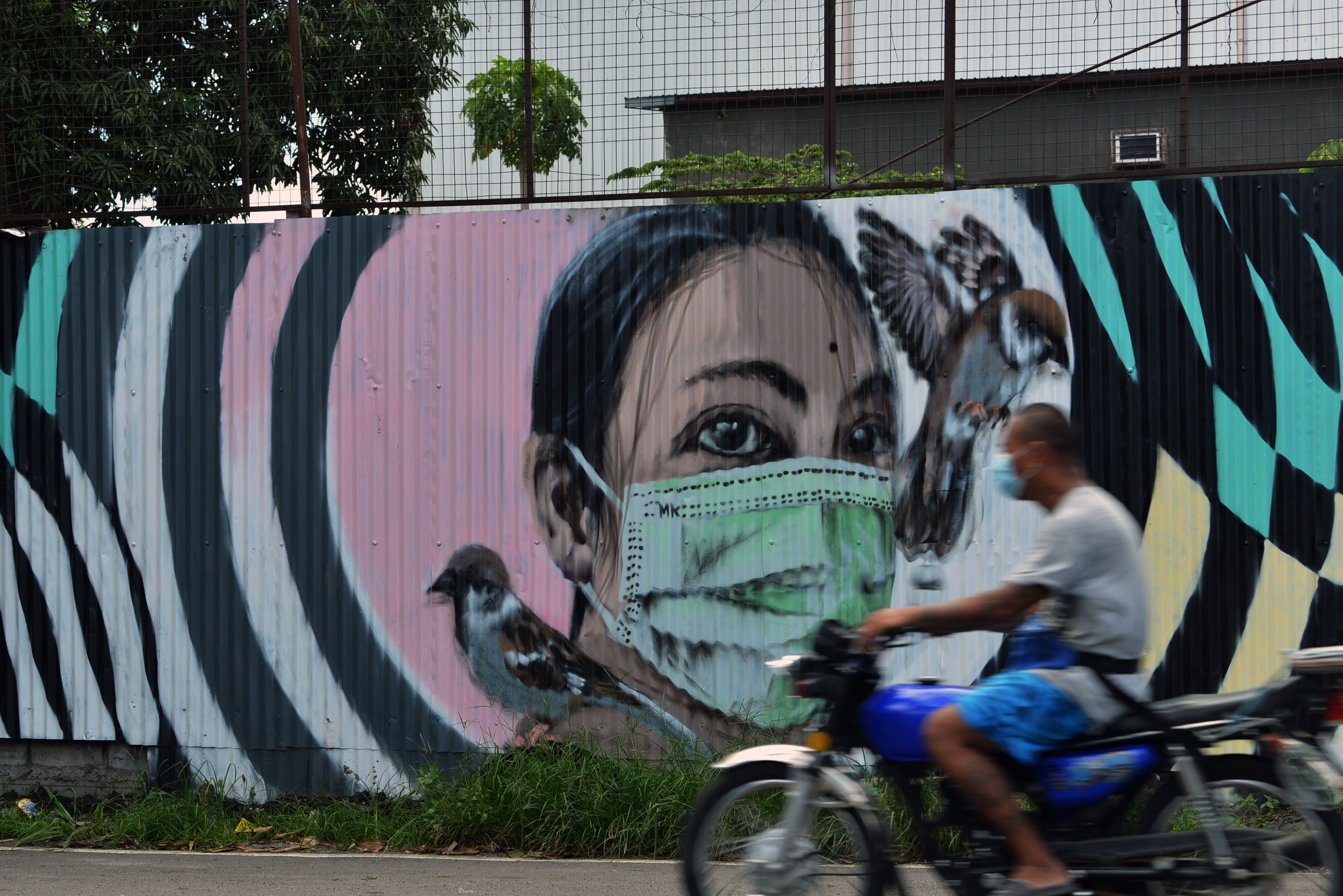 Meet the man behind Cavite’s pandemic-inspired murals