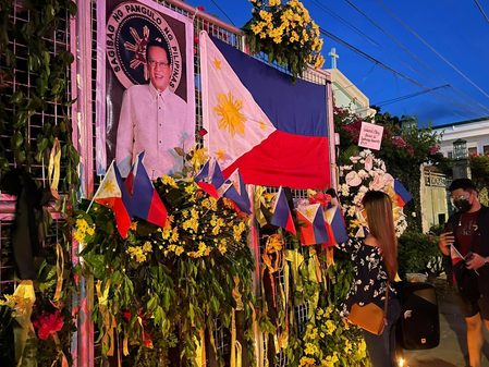 Aquino’s friends gather outside Zamboanga monastery where he decided to seek presidency