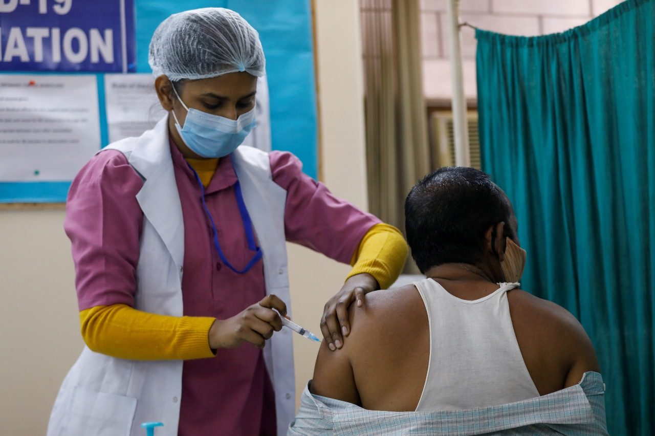 India to give adults free COVID-19 shots after bungled vaccine rollout