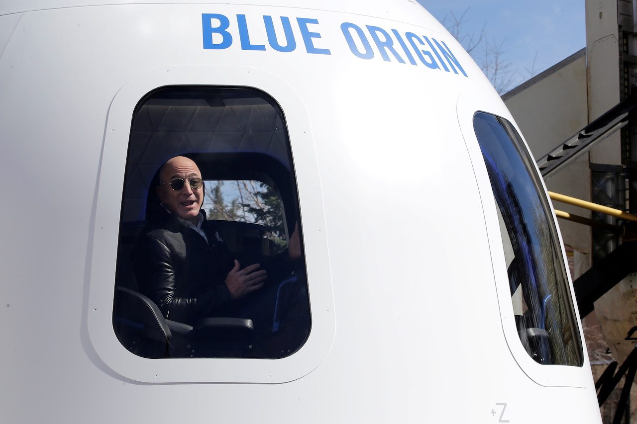 Bezos’ Blue Origin to make history with unpiloted civilian space flight