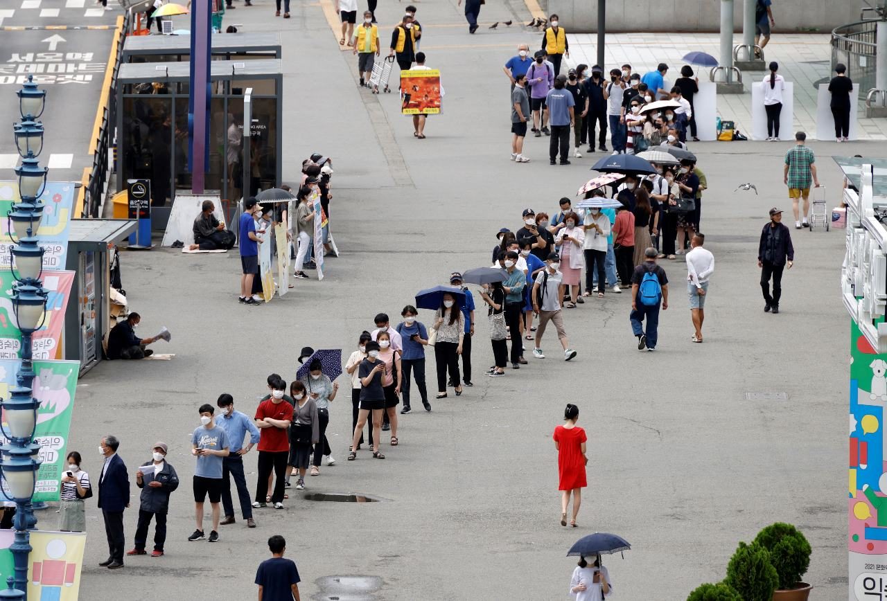 South Korea considers reimposing restrictions as COVID-19 cases surge