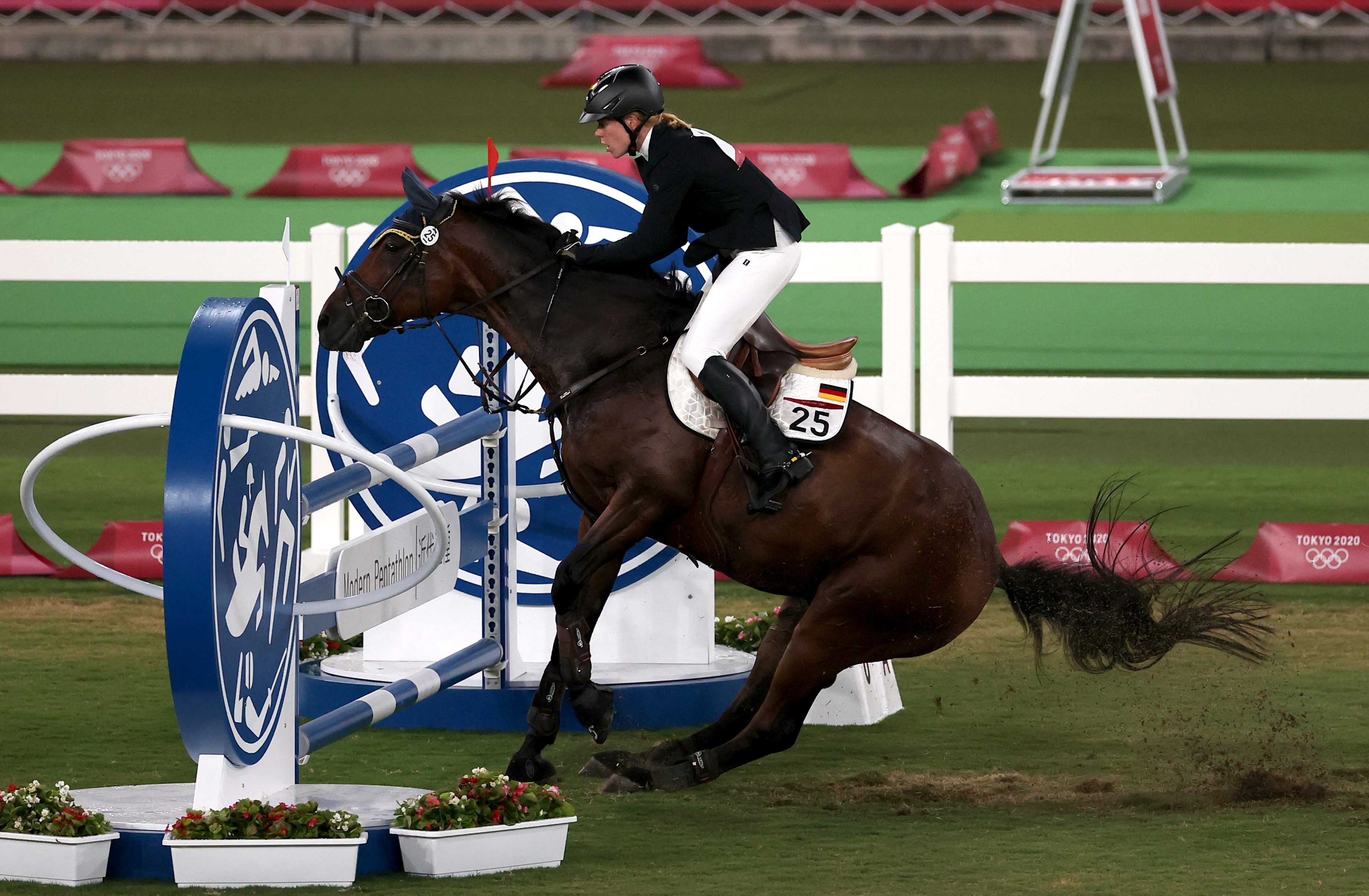 Germany’s modern pentathlon coach disqualified after punching horse